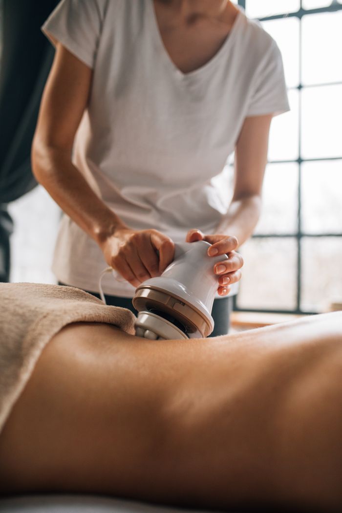 contact-img A soothing electronic massage session focusing on relaxation and self-care indoors.